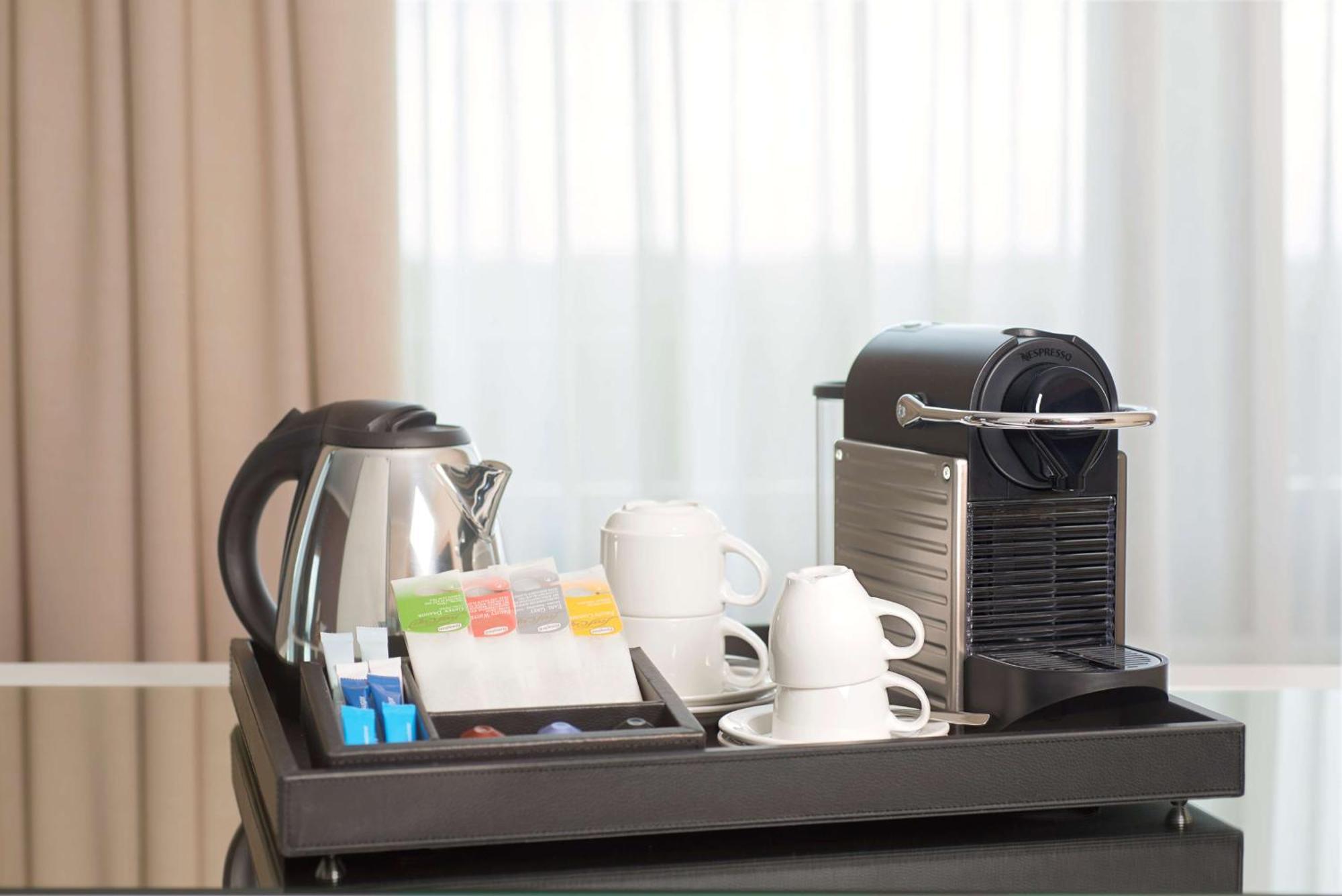 Nh Collection Plaza Santiago Hotel Kültér fotó A Nespresso coffee machine in a hotel room